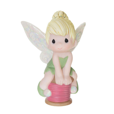 Tinker Bell porcelain ornament in Precious Moments style, sitting on a spool of thread, Disney Christmas décor.

