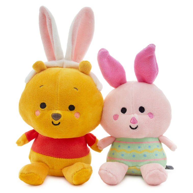 Disney plush Pooh in bunny ears and Piglet in an Easter egg outfit with magnetic connectors for spring gifting.
