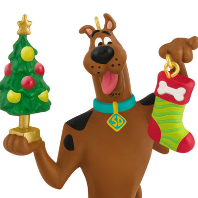 Hallmark Keepsake Tom and Jerry ornament featuring Tom the cat holding Jerry the mouse as a sandwich, with a red napkin tied around his neck.