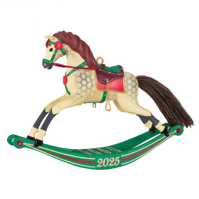 Hallmark Keepsake Rocking Horse Memories 2025 ornament—cream horse, brown mane and tail, red saddle, green sled base, red flower accents, year dated
