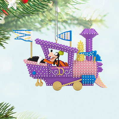 Hallmark Keepsake Disney Electrical Parade ornament featuring Mickey Mouse driving a purple train float with colorful lights and flags.