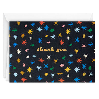 Black thank you cards with multicolor stars and gold foil lettering, shown in a kraft box with white envelopes, pack of 10
