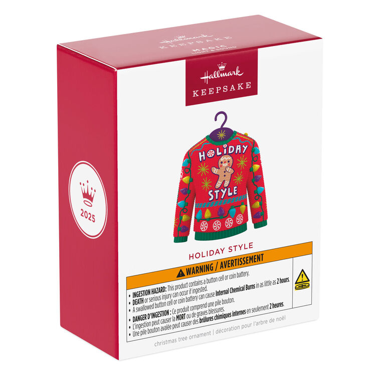 Red and green Christmas sweater ornament with gingerbread man, candy, and lights, plays "Carol of the Bells."

