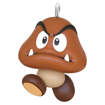 Hallmark Keepsake Mini Nintendo Super Mario Goomba ornament—brown mushroom-like enemy with sharp teeth, large eyes, oval feet, and angry eyebrows
