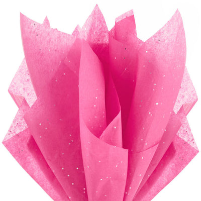 Hot pink Hallmark tissue paper with shimmering iridescent dots, displayed folded and fluffed in a gift bag.