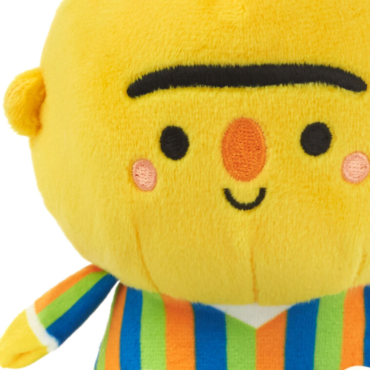 Plush Bert and Ernie toys with magnetic connectors, colorful outfits, and embroidered Sesame Street features.
