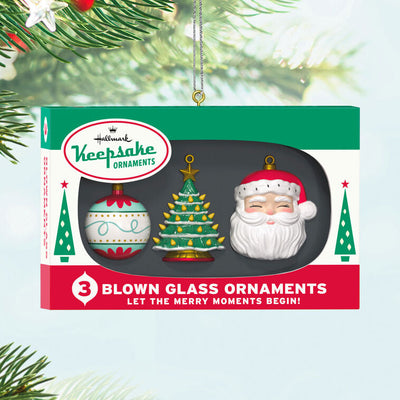 Retro ornament box with three vintage-style glass ornaments: ball, tree, and Santa face