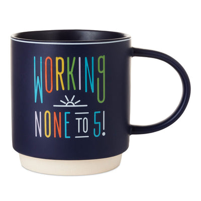 Midnight blue ceramic retirement mug with “Working none to 5” message and sunrise illustration; stackable with large handle.