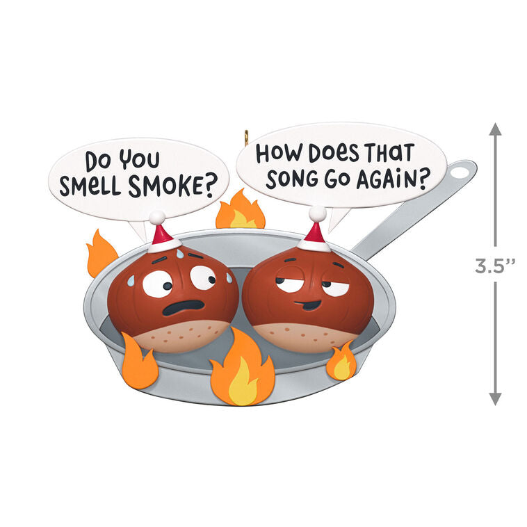 Funny Christmas ornament with two chestnuts roasting in a flaming skillet.

