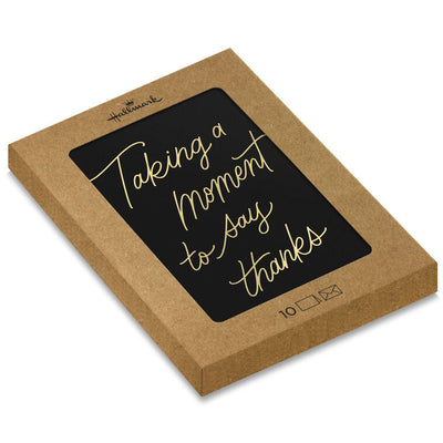 Black thank-you cards with elegant gold foil script reading “Taking a moment to say thanks.”
