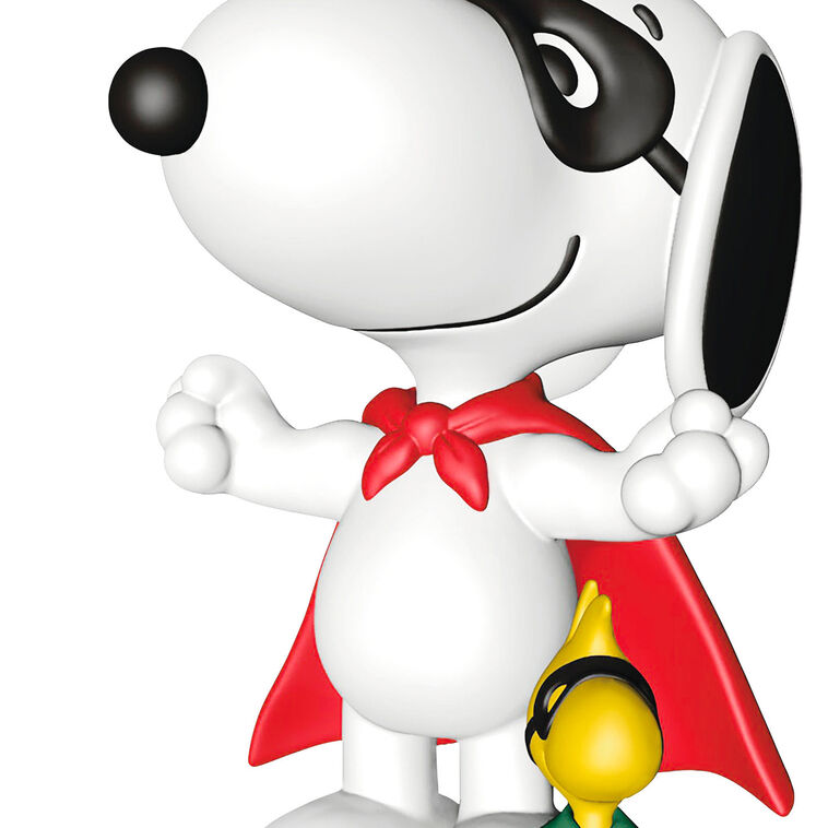 Hallmark Keepsake Peanuts ornament of Snoopy and Woodstock wearing superhero capes and masks, posed as festive holiday heroes.