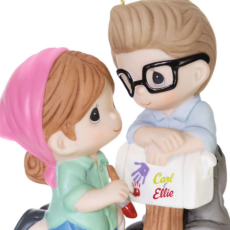 Porcelain ornament of Carl and Ellie from Disney Pixar’s Up painting a mailbox, in Precious Moments style