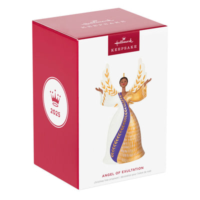 Angel ornament in gold, white, and purple gown with raised hands and detailed wings, a radiant Hallmark Keepsake holiday symbol of faith.