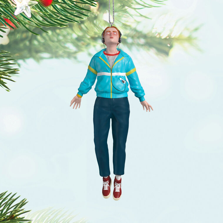 Max Mayfield ornament in blue and yellow windbreaker, levitating with headphones, inspired by Stranger Things TV series.

