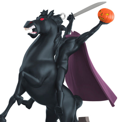 Headless Horseman Halloween ornament from Disney's Sleepy Hollow, riding black horse with sword and jack-o'-lantern
