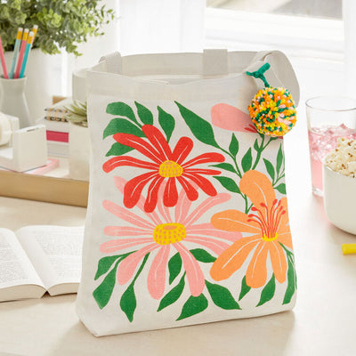 Hallmark 10.5-inch wildflowers fabric gift bag with retro floral design and pom-pom
