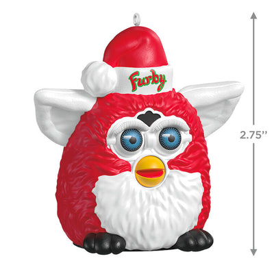 Festive Furby ornament, red and white electronic toy with blue eyes, yellow beak, Santa hat, Hallmark Keepsake, Christmas decoration.