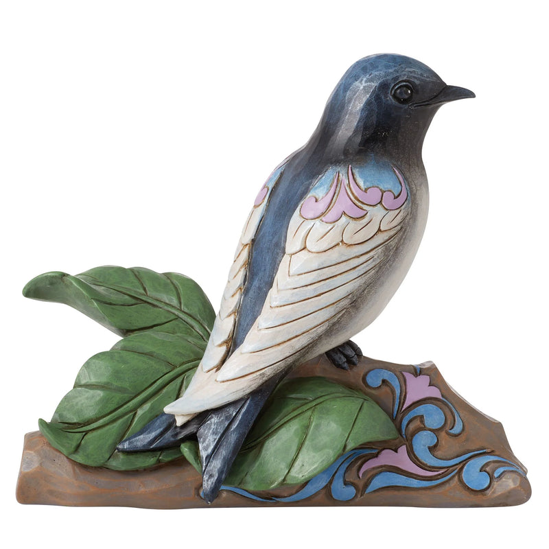 Jim Shore Purple Martin bird figurine with rosemaling, perched on a tree branch.
Character count: 98 — includes visual details and keywords like “Jim Shore,” “Purple Martin,” and “figurine.”

