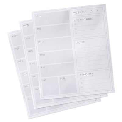Floral weekly planner pad with gold foil accents and tear-off sheets for notes and scheduling.