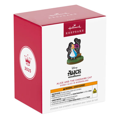 Alice stands in Wonderland before a glowing tree as the Cheshire Cat fades in and out in this Hallmark Keepsake Disney ornament.