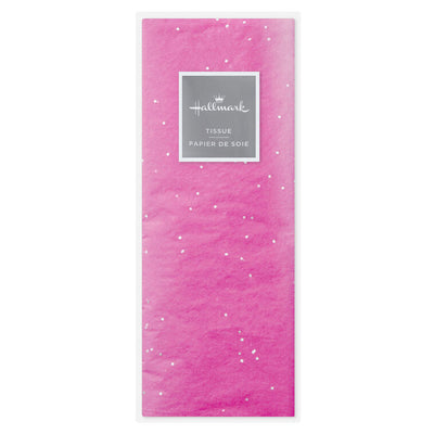 Hot pink Hallmark tissue paper with shimmering iridescent dots, displayed folded and fluffed in a gift bag.