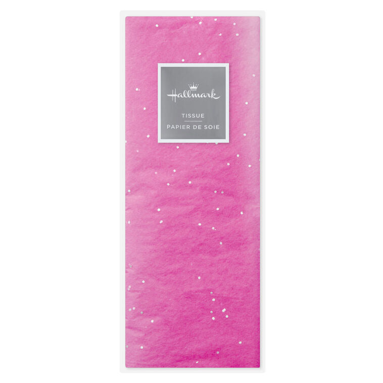 Hot pink Hallmark tissue paper with shimmering iridescent dots, displayed folded and fluffed in a gift bag.