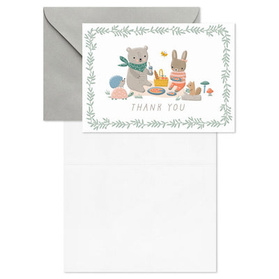 Baby thank you cards with bear and bunny picnic illustration framed by greenery, includes 10 blank white cards and kraft envelopes