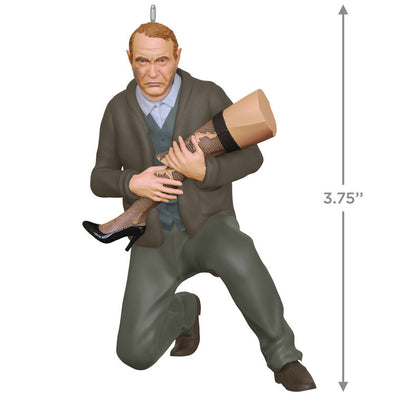 Hallmark Keepsake ornament of Old Man Parker kneeling and cradling broken leg lamp, A Christmas Story movie scene