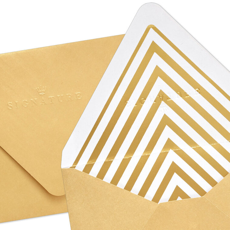 Gold metallic envelopes with white and gold chevron liner and pointed flaps, perfect for cards and special occasions.
