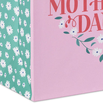 Hallmark medium pink gift bag with floral heart design, green vine, white flowers, and Happy Mother's Day message in red