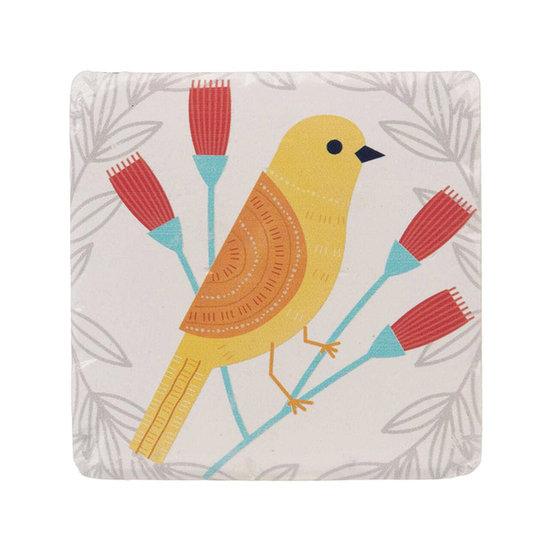 A set of four white resin coasters with blue and yellow birds perched on leafy branches in vibrant colors