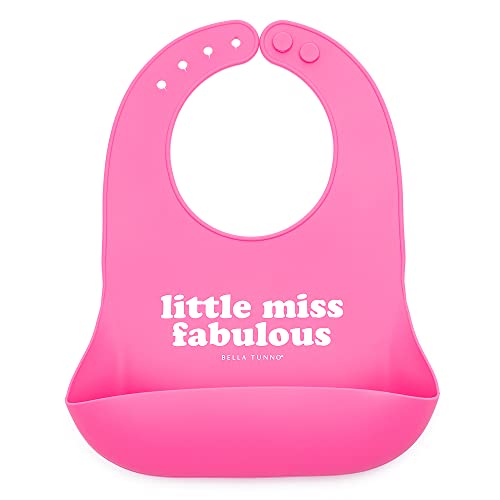 Soft silicone baby bib in pink with “Little Miss Fabulous” print and deep food-catching pocket, adjustable neck closure.

