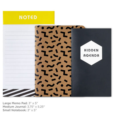 Stationery set with black and kraft notebooks and a memo pad featuring “Noted” and “Hidden Agenda” covers with geometric designs.
