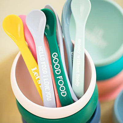 Set of two baby spoons in Eat Cake and Hail Queen colors, made of soft, teething-friendly silicone.

