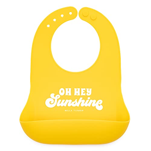Bright yellow silicone baby bib with &