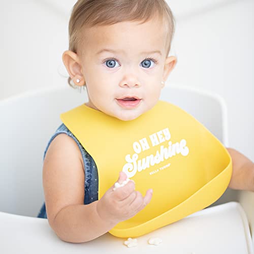 Bright yellow silicone baby bib with &