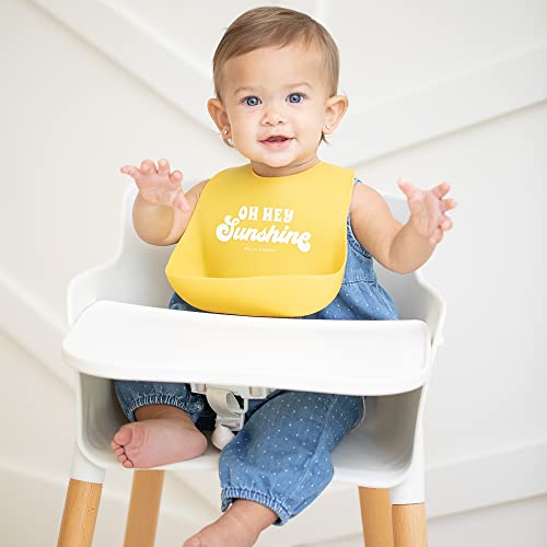 Bright yellow silicone baby bib with &