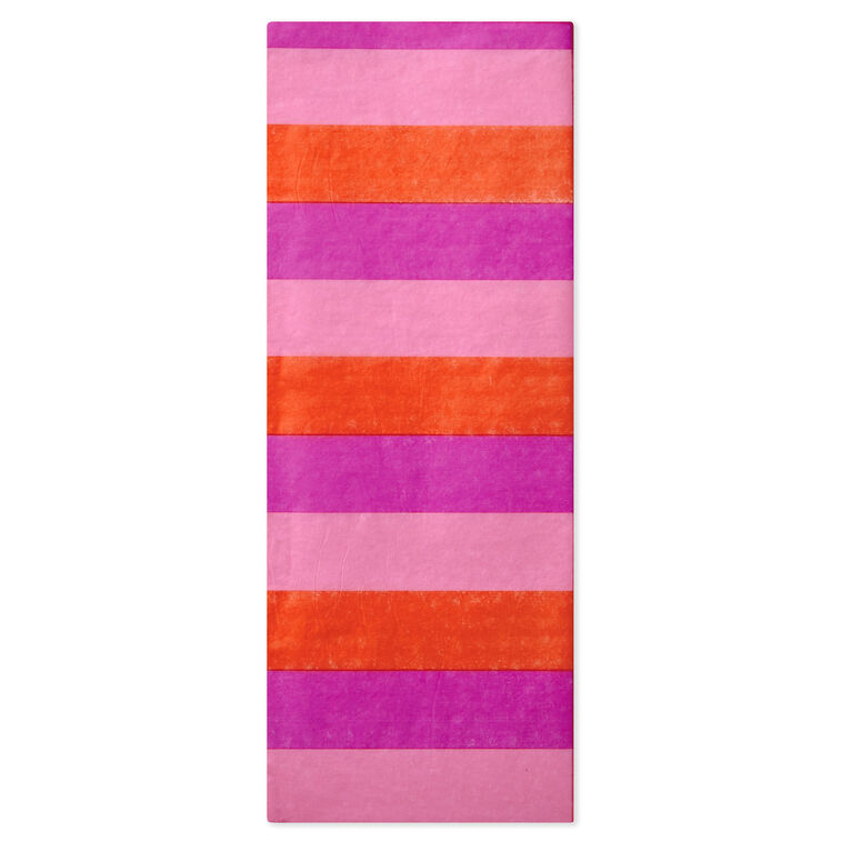 Hallmark tissue paper in horizontal magenta, orange, and pink stripes, styled in flat lay and fluffed in a gift bag for festive presentation