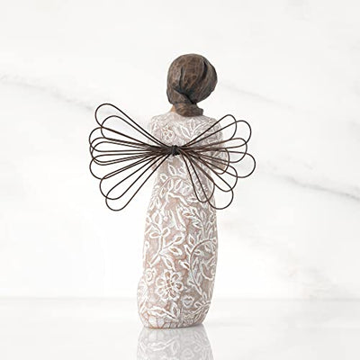 Willow Tree Remembrance angel with darker skin and hair, wire wings, gold leaf heart, and memory-themed carvings on dress.