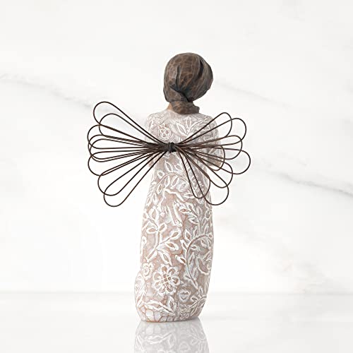 Willow Tree Remembrance angel with darker skin and hair, wire wings, gold leaf heart, and memory-themed carvings on dress.