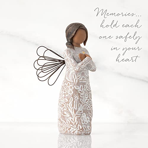 Willow Tree Remembrance angel with darker skin and hair, wire wings, gold leaf heart, and memory-themed carvings on dress.