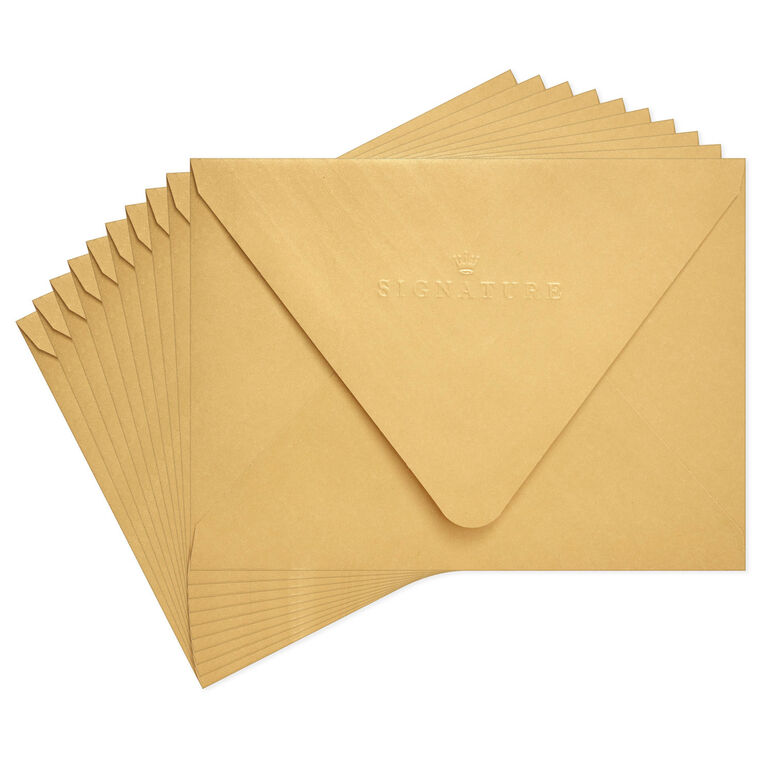 Gold metallic envelopes with white and gold chevron liner and pointed flaps, perfect for cards and special occasions.
