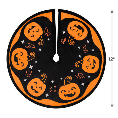 Mini Halloween tree skirt with orange and black design, smiling jack-o’-lanterns, and embroidered accents
