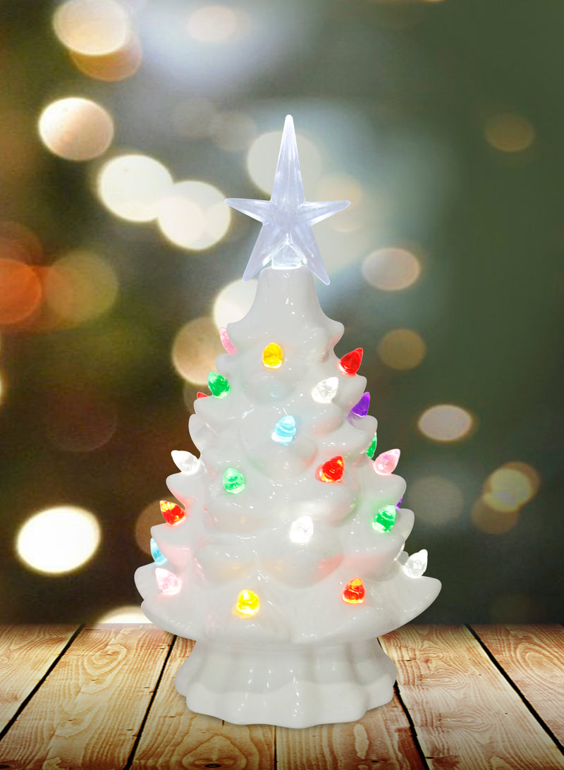 White ceramic Christmas tree with multicolor lights and glowing star topper.
