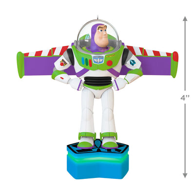 Buzz Lightyear Christmas ornament with wings extended on blue base, featuring light and sound effects