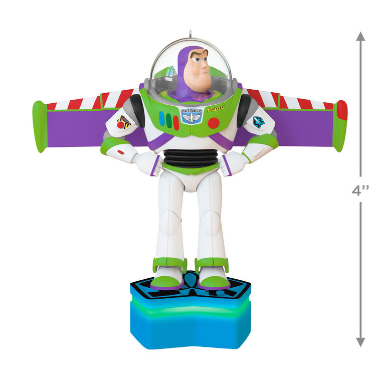 Buzz Lightyear Christmas ornament with wings extended on blue base, featuring light and sound effects