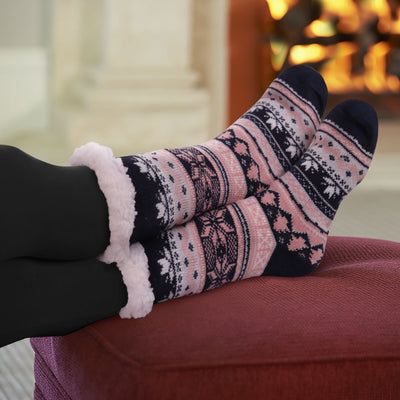 Thermal slipper socks with woodland animals and wintry patterns in gray, pink, and navy colors, fleece-lined.