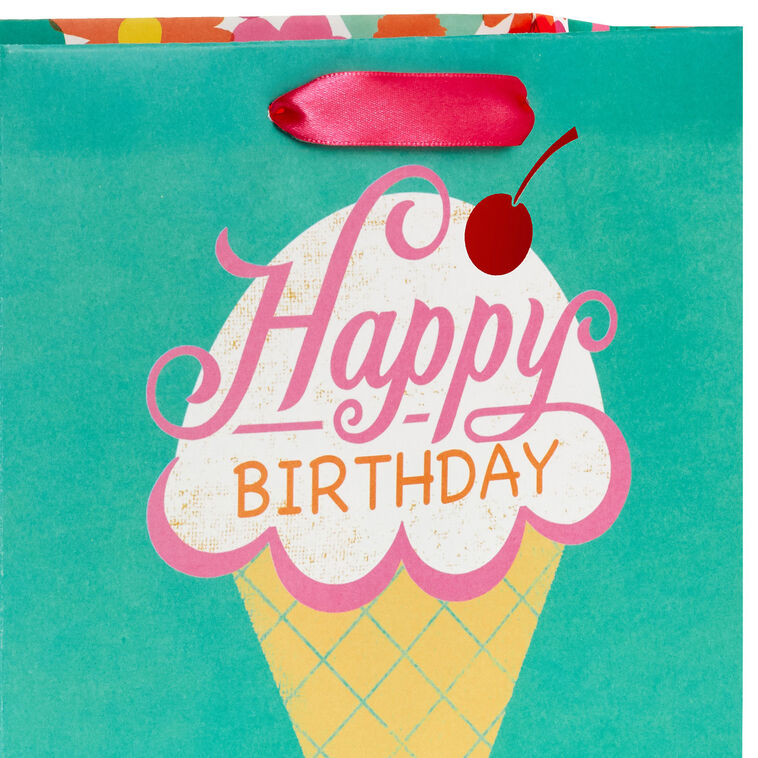 Hallmark birthday gift bag with colorful ice cream cone design, whimsical font, and red foil cherry on green background.