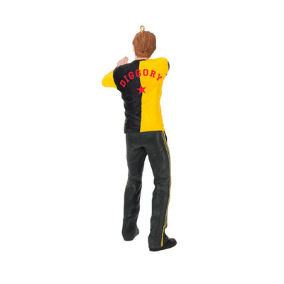 Cedric Diggory in yellow and black Hufflepuff robes raising his wand in a Harry Potter Christmas tree ornament