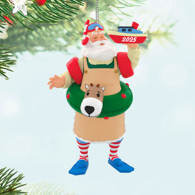 Santa in snorkel mask, arm floaties, and striped socks, with reindeer swim tube and toy boat marked 2025, Hallmark Keepsake ornament
